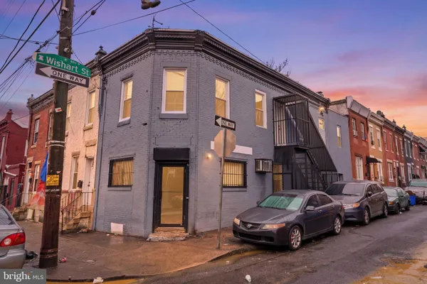 a front view of a house with parking