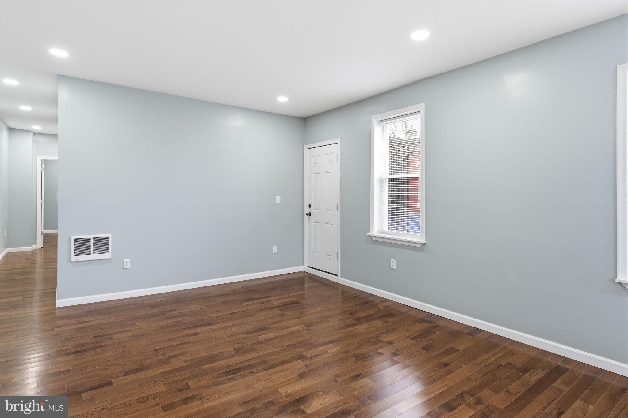 3128 F Street Philadelphia, PA 19134 - Photo 19 of 30 a view of an empty room with wooden floor and a window