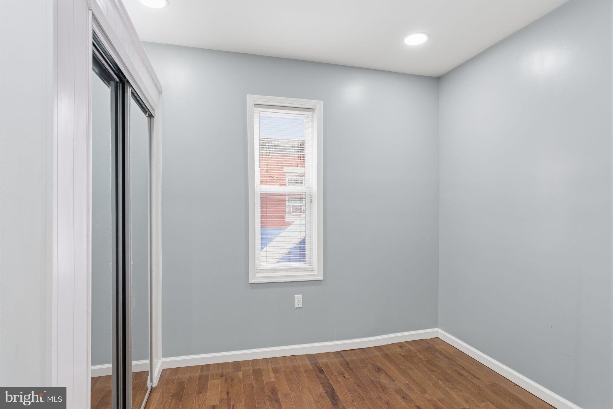 3128 F Street Philadelphia, PA 19134 - Photo 24 of 30 an empty room with wooden floor and windows