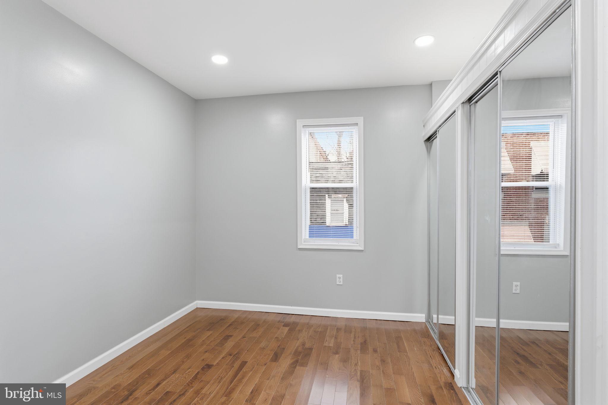 3128 F Street Philadelphia, PA 19134 - Photo 26 of 30 an empty room with wooden floor and windows