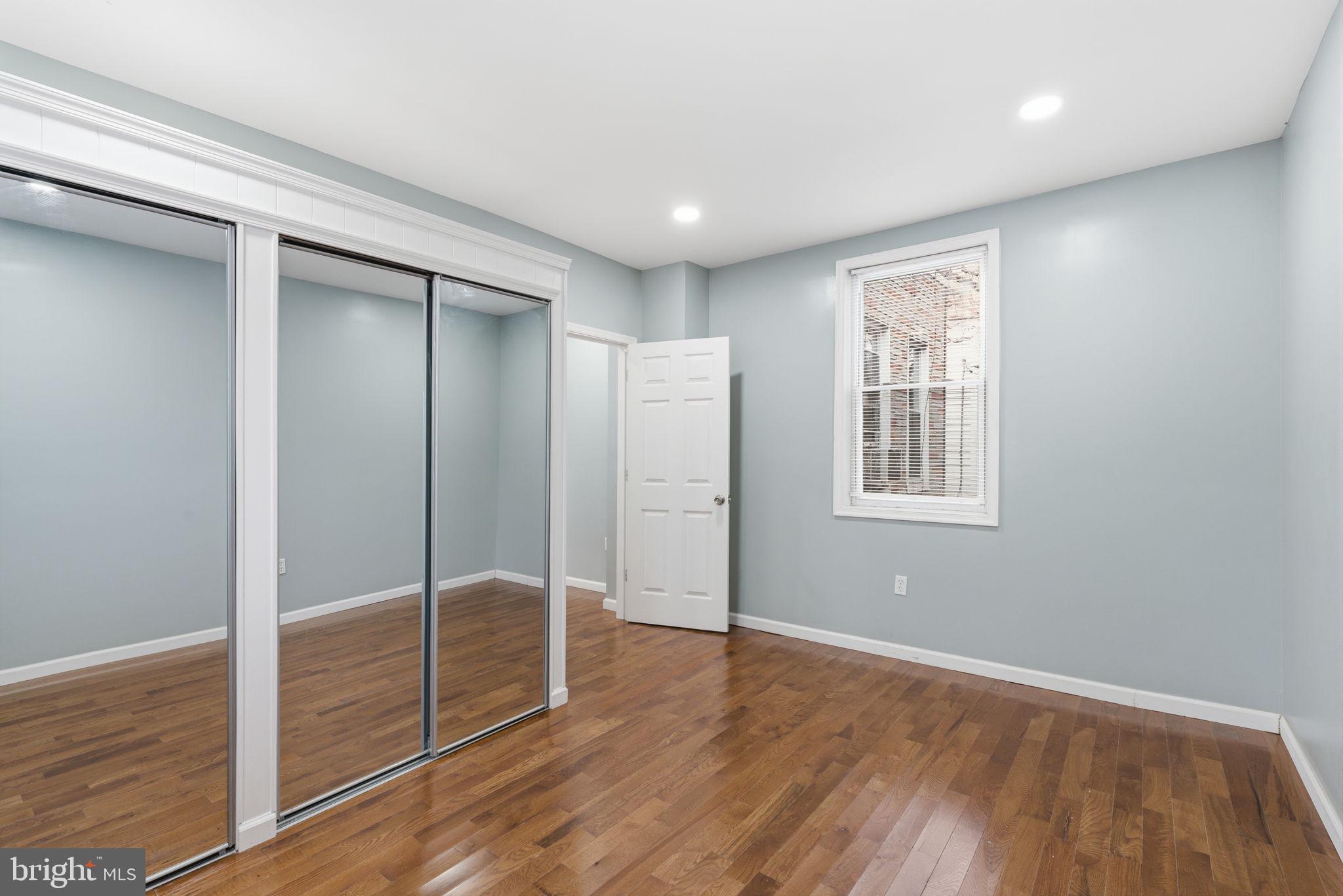3128 F Street Philadelphia, PA 19134 - Photo 27 of 30 a view of an empty room with window and wooden floor