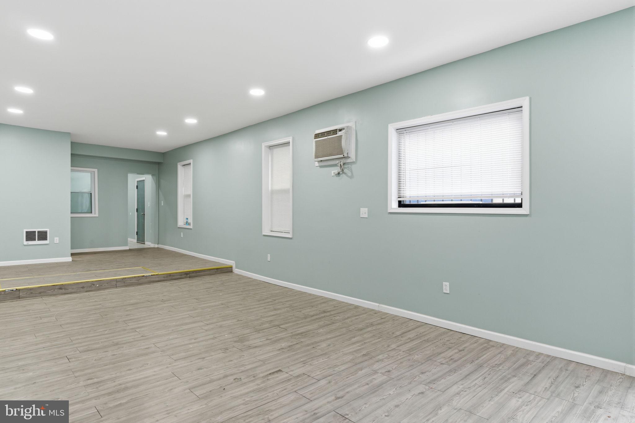 3128 F Street Philadelphia, PA 19134 - Photo 6 of 30 an empty room with wooden floor and windows