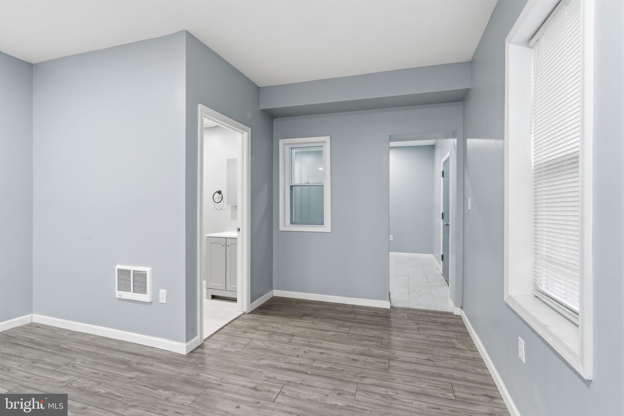 3128 F Street Philadelphia, PA 19134 - Photo 7 of 30 a view of livingroom with hallway and wooden floor