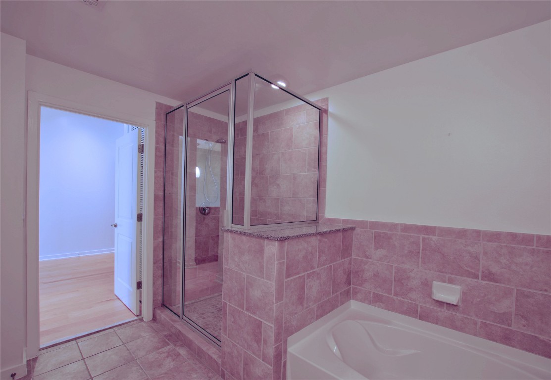 360 Nueces Street, Unit 913 Austin, TX 78701 - Photo 11 of 30 a bathroom with a bathtub and shower