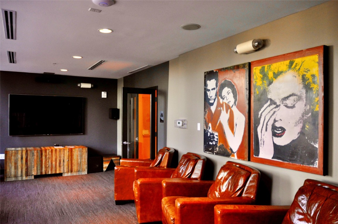 360 Nueces Street, Unit 913 Austin, TX 78701 - Photo 17 of 30 a living room with furniture and a flat screen tv