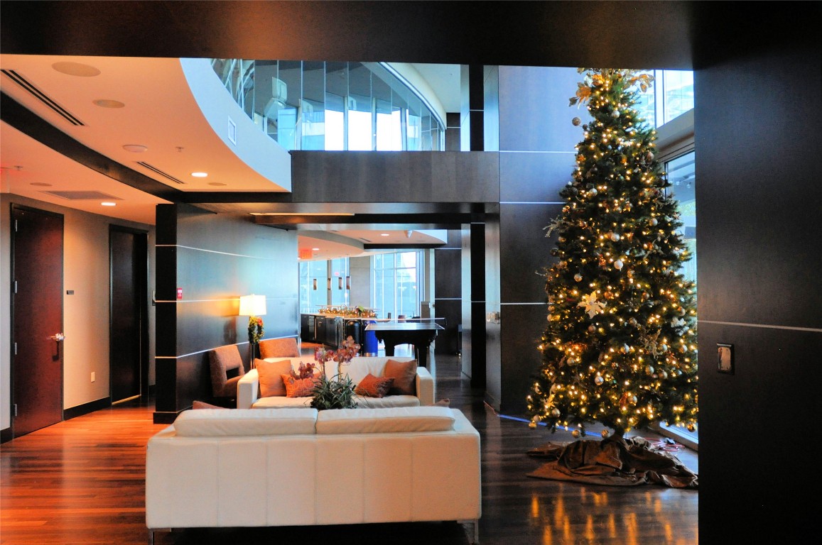 360 Nueces Street, Unit 913 Austin, TX 78701 - Photo 18 of 30 a living room with furniture and a chandelier