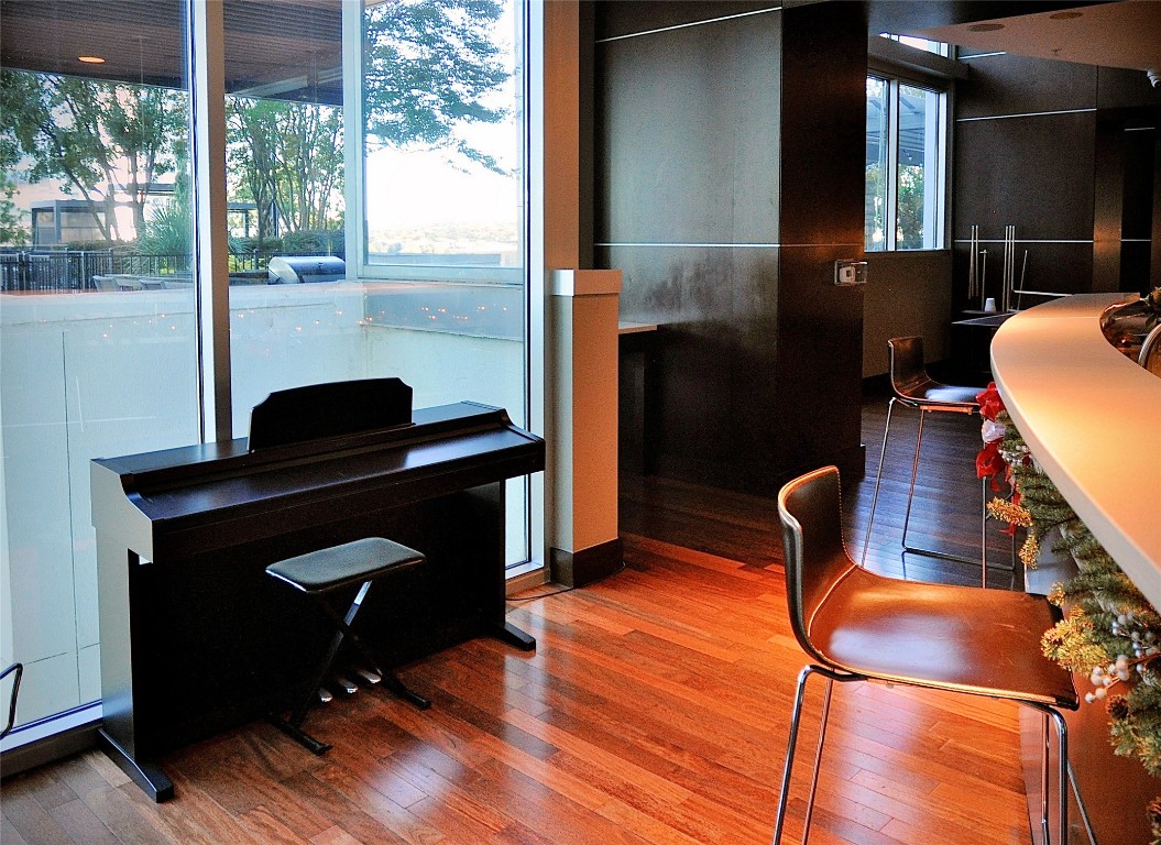 360 Nueces Street, Unit 913 Austin, TX 78701 - Photo 20 of 30 a dining room with furniture and wooden floor