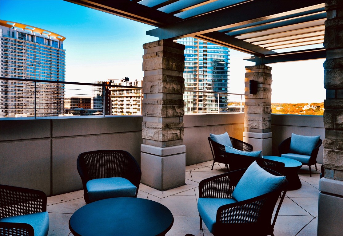 360 Nueces Street, Unit 913 Austin, TX 78701 - Photo 26 of 30 a outdoor space with patio couches and a fireplace