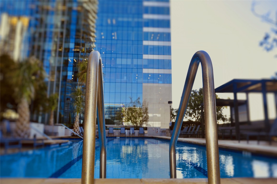 360 Nueces Street, Unit 913 Austin, TX 78701 - Photo 29 of 30 a front view of a house with outdoor space and seating