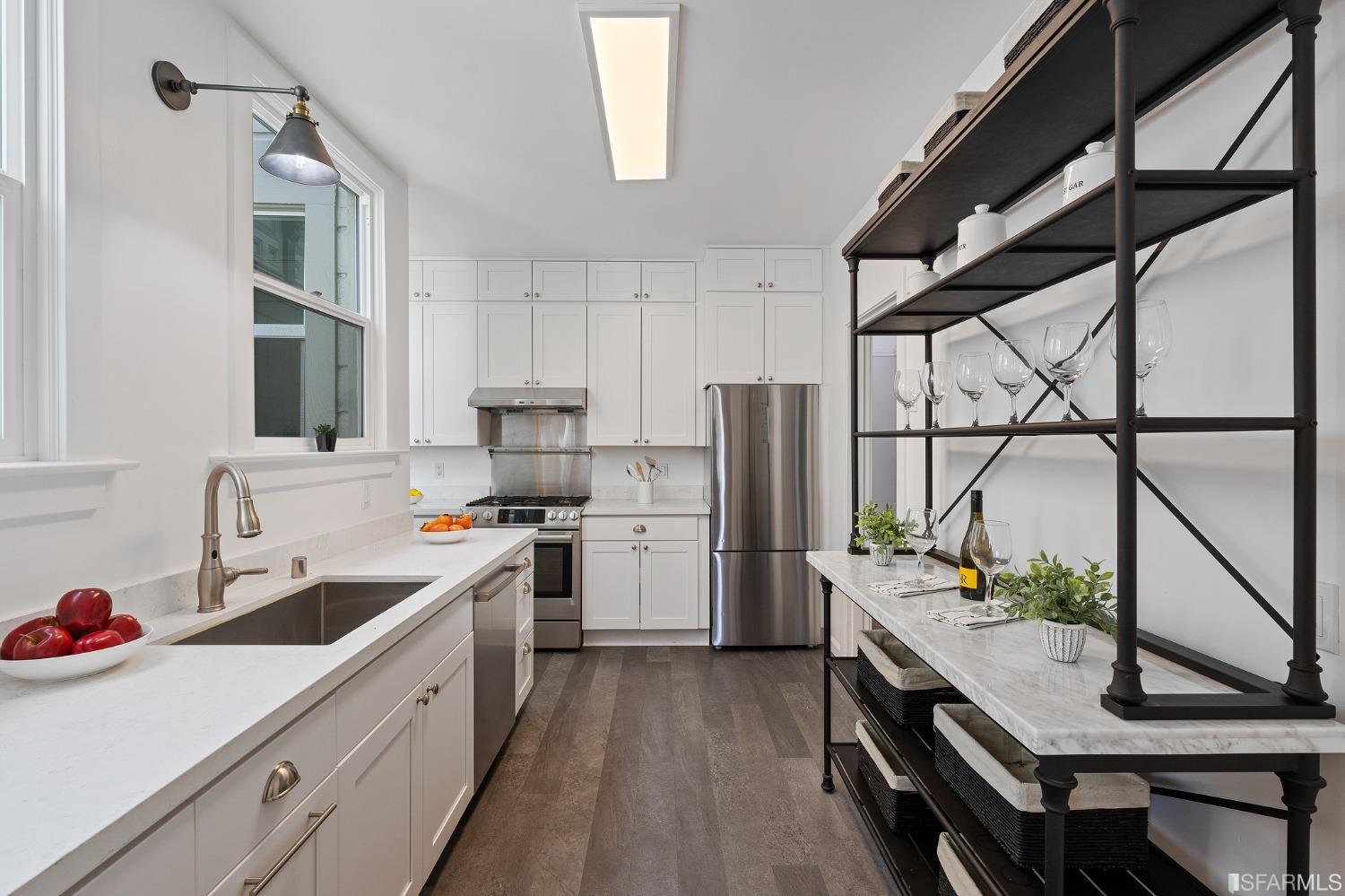 439-441 11th Avenue San Francisco, CA 94118 - Photo 14 of 73 a kitchen with a sink a refrigerator and cabinets