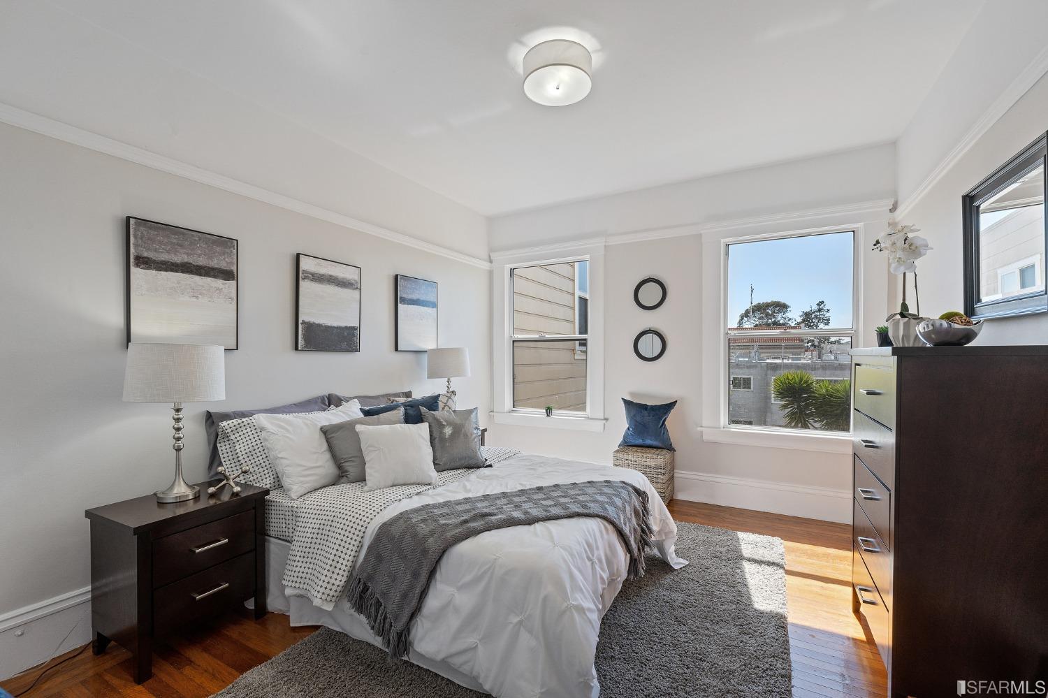 439-441 11th Avenue San Francisco, CA 94118 - Photo 21 of 73 a bed room with a bed and a tv