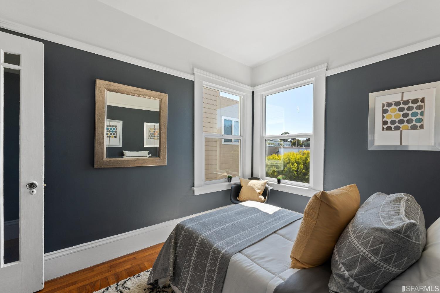 439-441 11th Avenue San Francisco, CA 94118 - Photo 29 of 73 a bed room with a bed and a large window