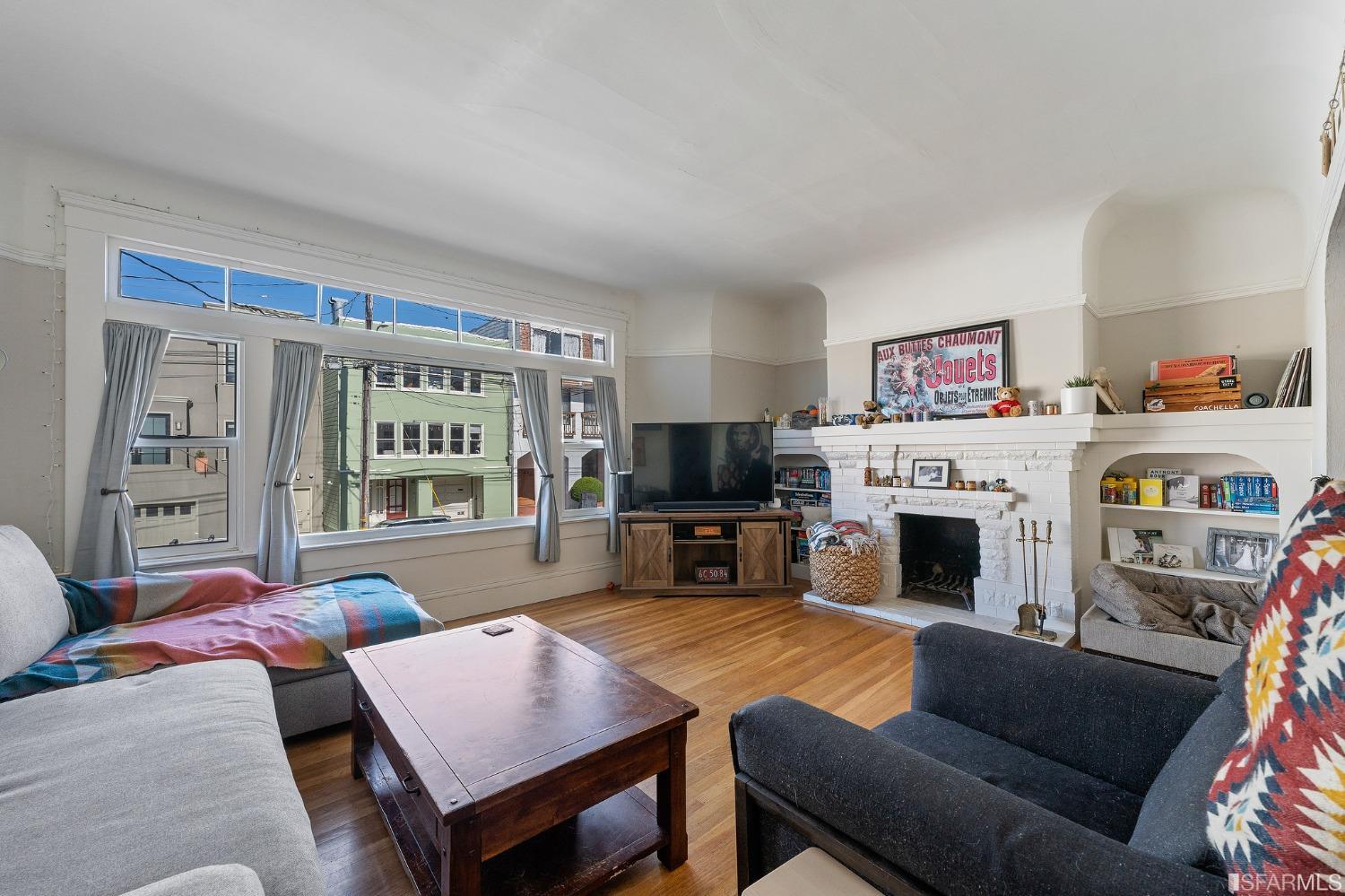 439-441 11th Avenue San Francisco, CA 94118 - Photo 41 of 73 a living room with furniture fireplace and flat screen tv