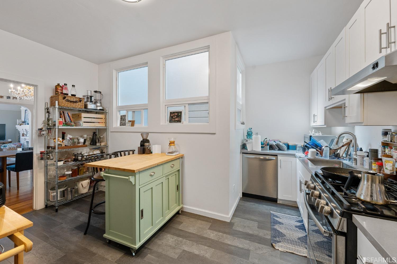 439-441 11th Avenue San Francisco, CA 94118 - Photo 44 of 73 a kitchen with a stove a refrigerator and a window