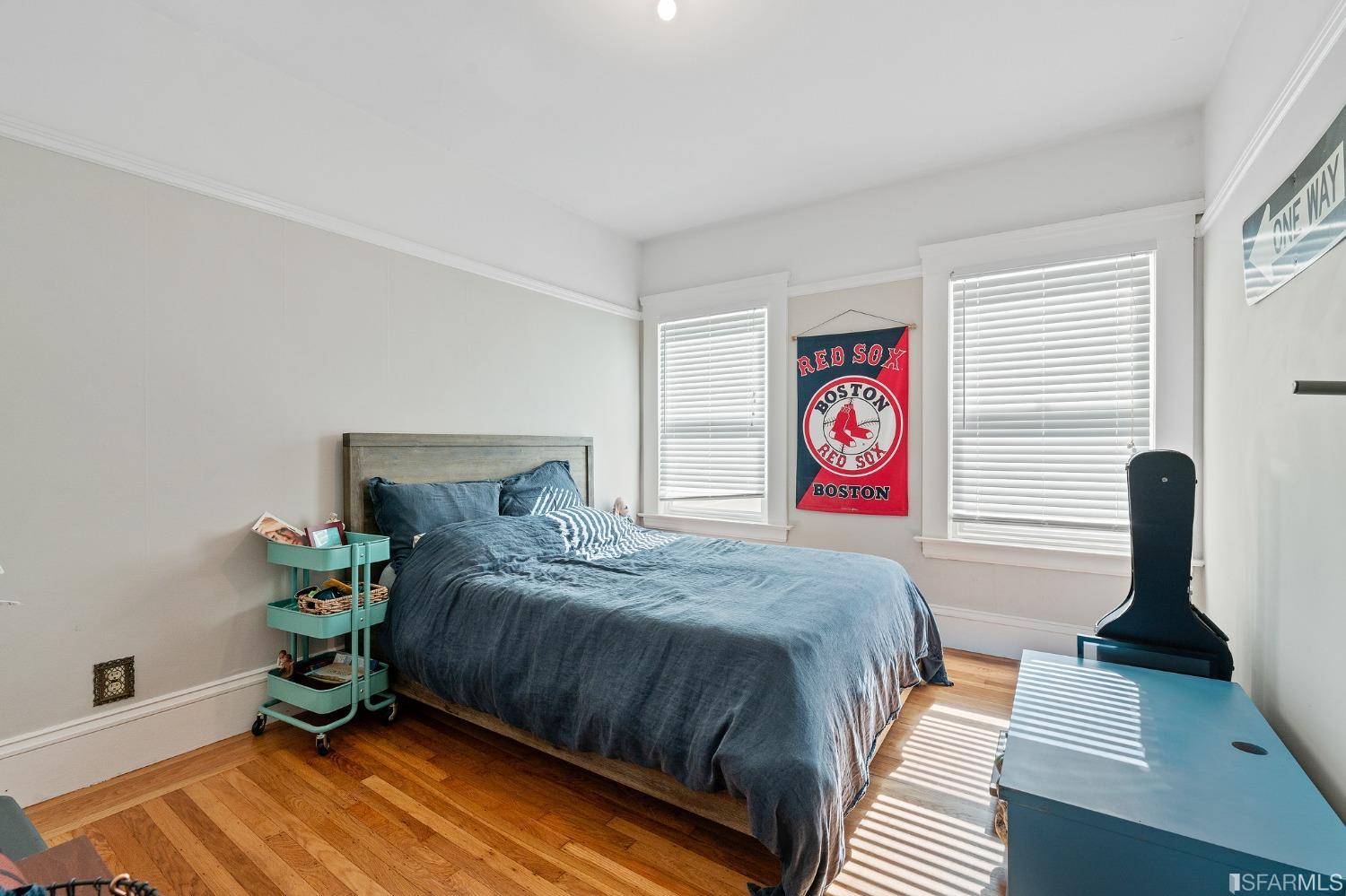 439-441 11th Avenue San Francisco, CA 94118 - Photo 45 of 73 a bedroom with a bed and a window