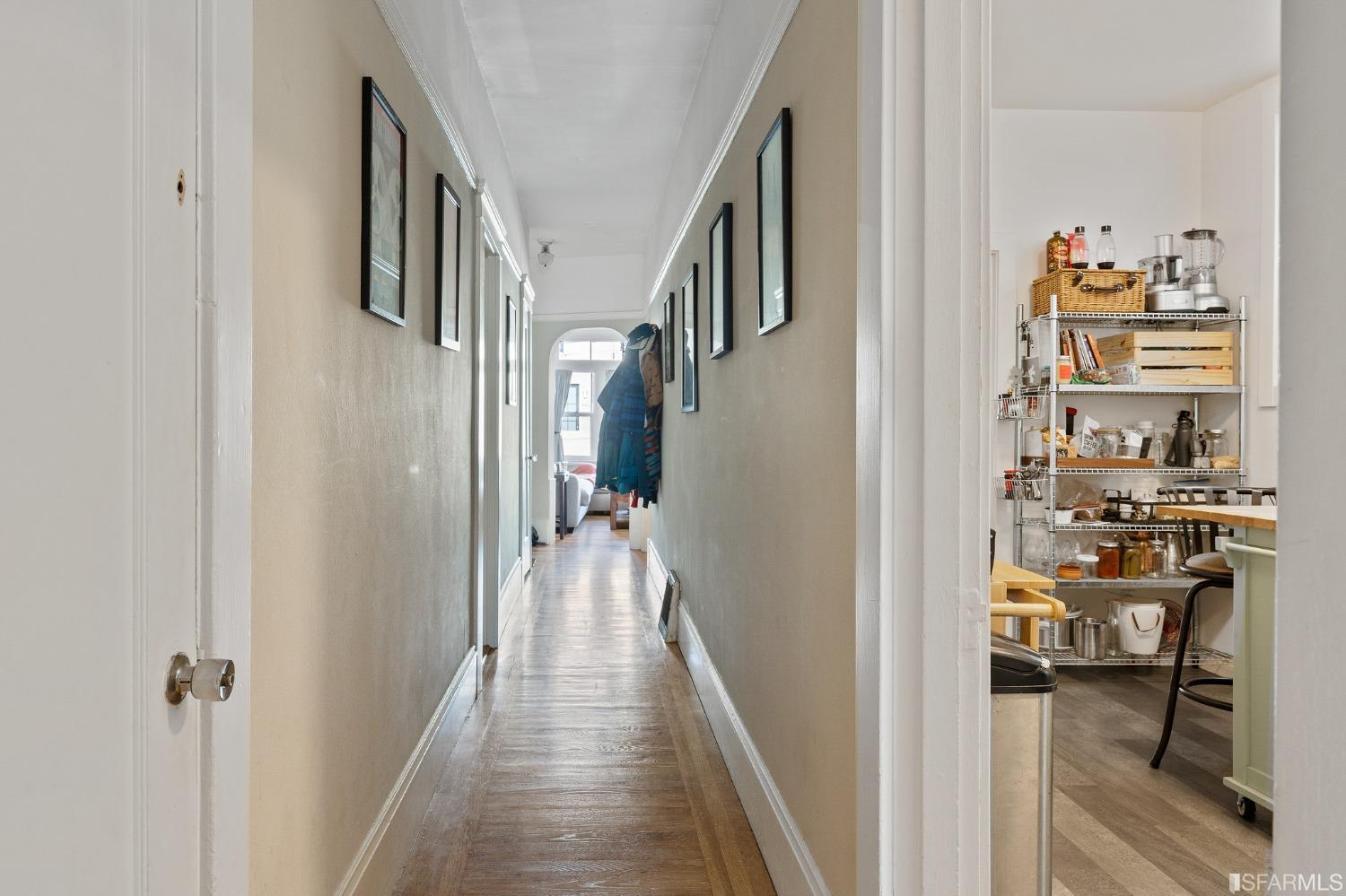 439-441 11th Avenue San Francisco, CA 94118 - Photo 47 of 73 a view of a hallway with dining room and wooden floor