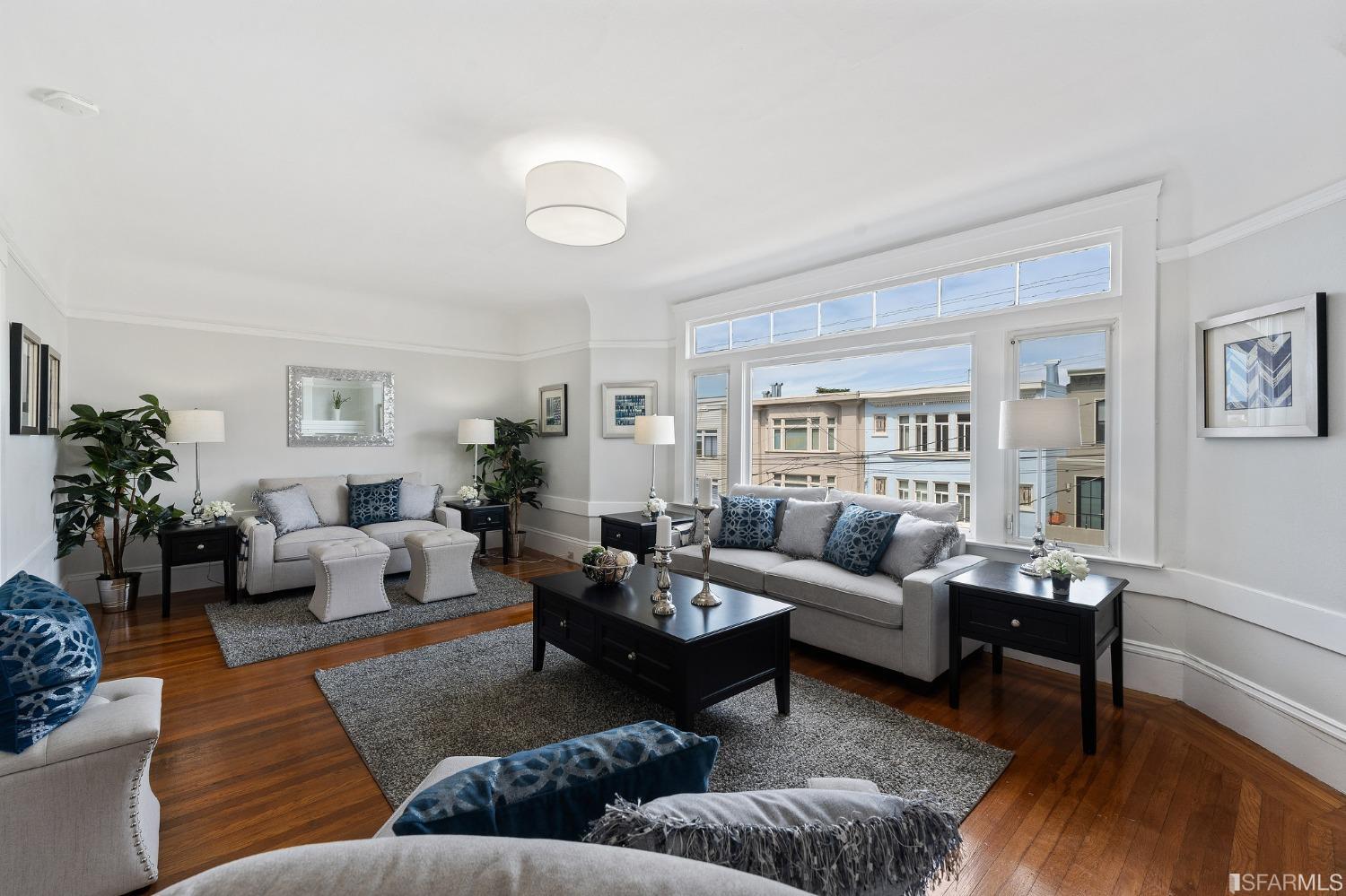 439-441 11th Avenue San Francisco, CA 94118 - Photo 5 of 73 a living room with furniture or couch and a wooden floor