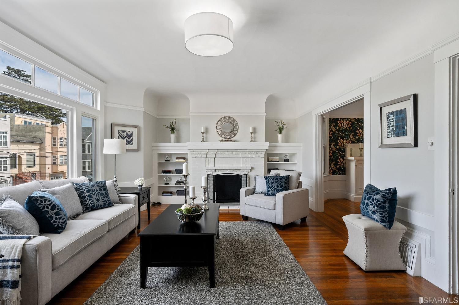 439-441 11th Avenue San Francisco, CA 94118 - Photo 7 of 73 a living room with furniture and a fireplace