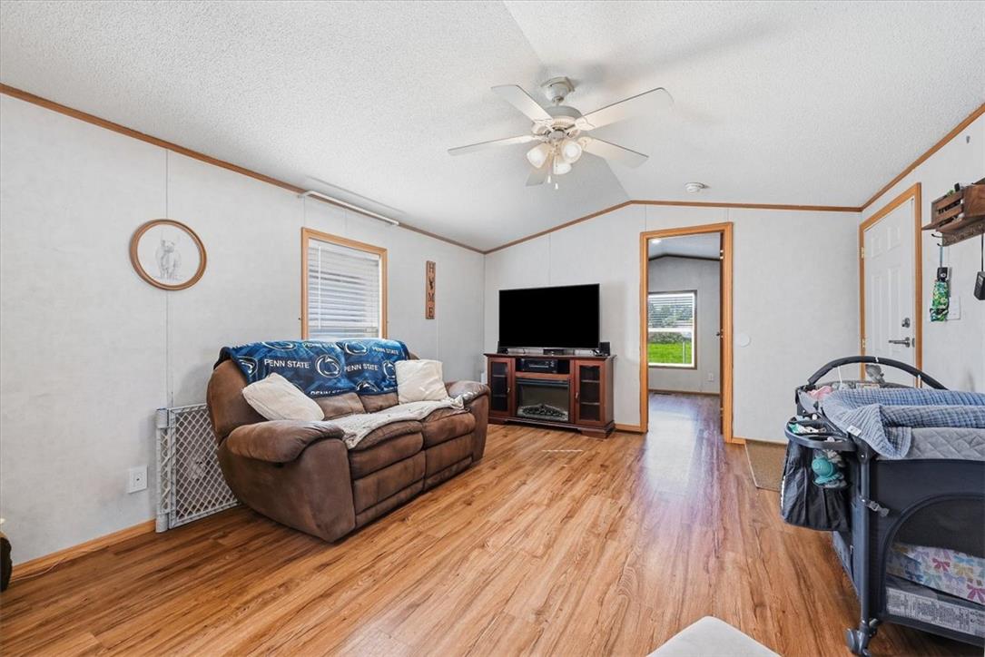 6129 Memorial Road Allentown, PA 18104 - Photo 15 of 46 Warm wood flooring grounds this inviting living space complete with a vaulted ceiling.