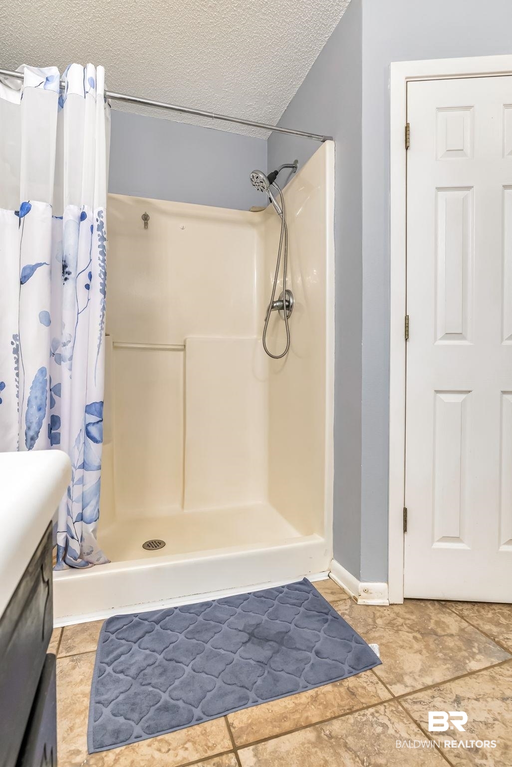 12199 Bay Road West Foley, AL 36535 - Photo 34 of 62 Bathroom with a shower stall, a textured ceiling, and vanity