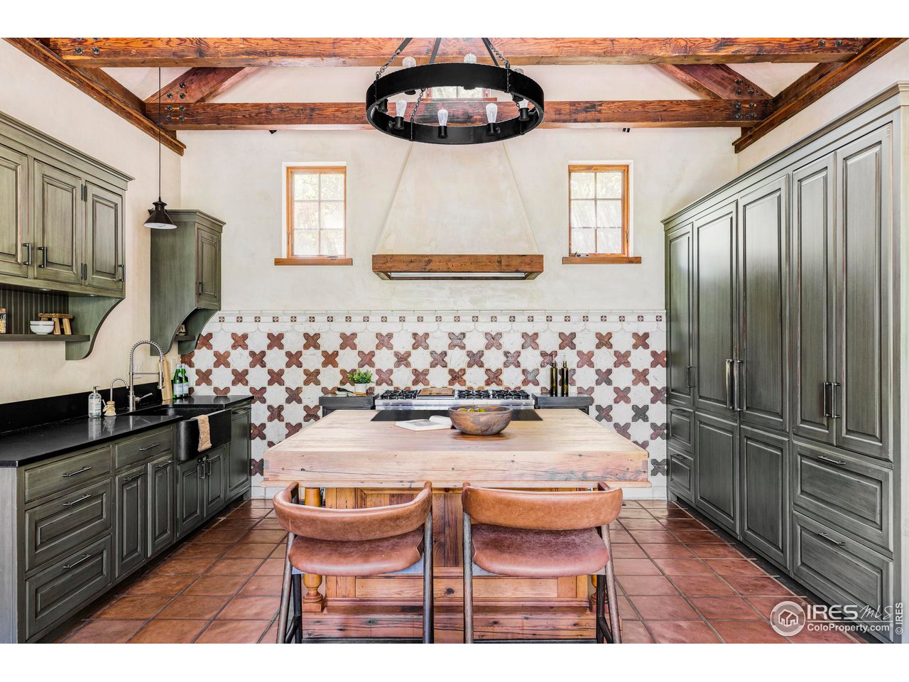 1213 17th Street Boulder, CO 80302 - Photo 11 of 38 a kitchen with stainless steel appliances granite countertop a sink and a refrigerator