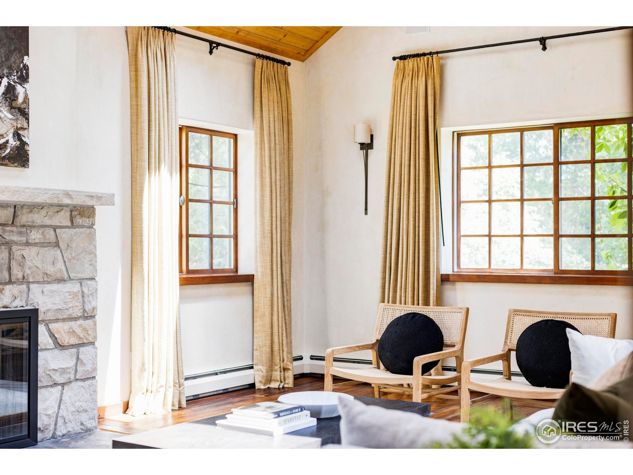 1213 17th Street Boulder, CO 80302 - Photo 13 of 38 a living room with furniture and a fireplace