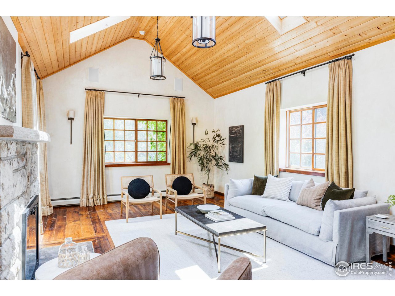 1213 17th Street Boulder, CO 80302 - Photo 15 of 38 a living room with furniture and a window