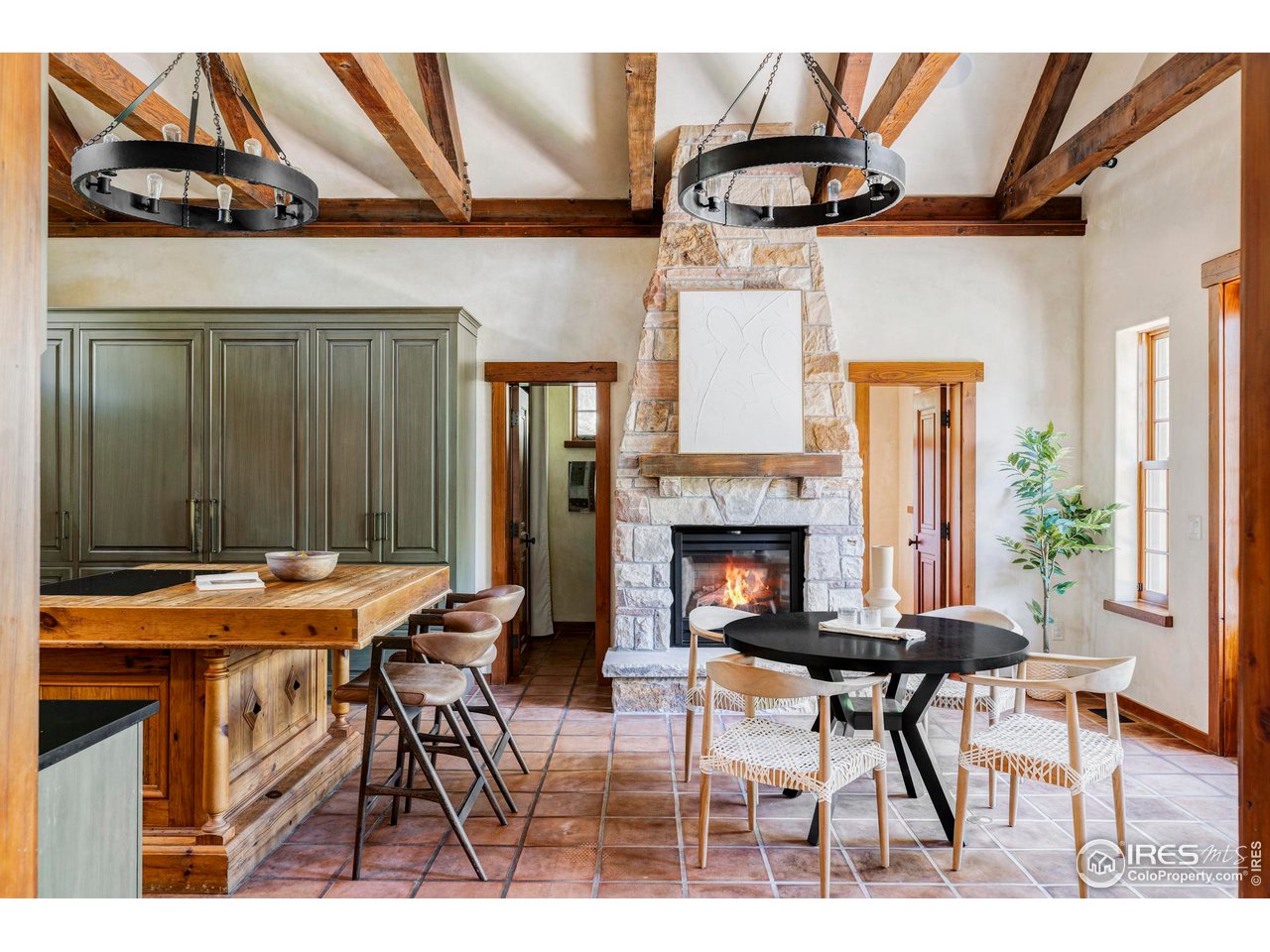 1213 17th Street Boulder, CO 80302 - Photo 2 of 38 a view of a dining room with furniture and a fireplace