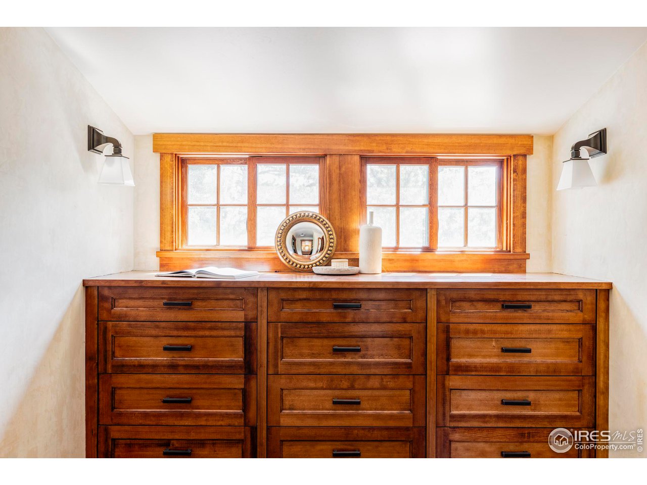 1213 17th Street Boulder, CO 80302 - Photo 22 of 38 a bathroom with a sink a mirror and a window