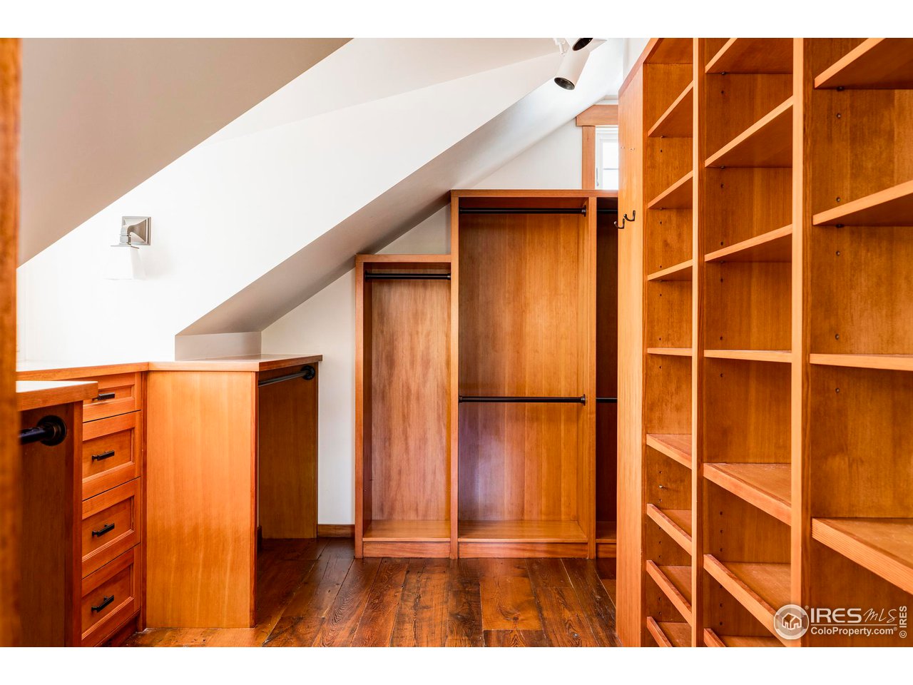 1213 17th Street Boulder, CO 80302 - Photo 23 of 38 a view of an empty room with wooden floor
