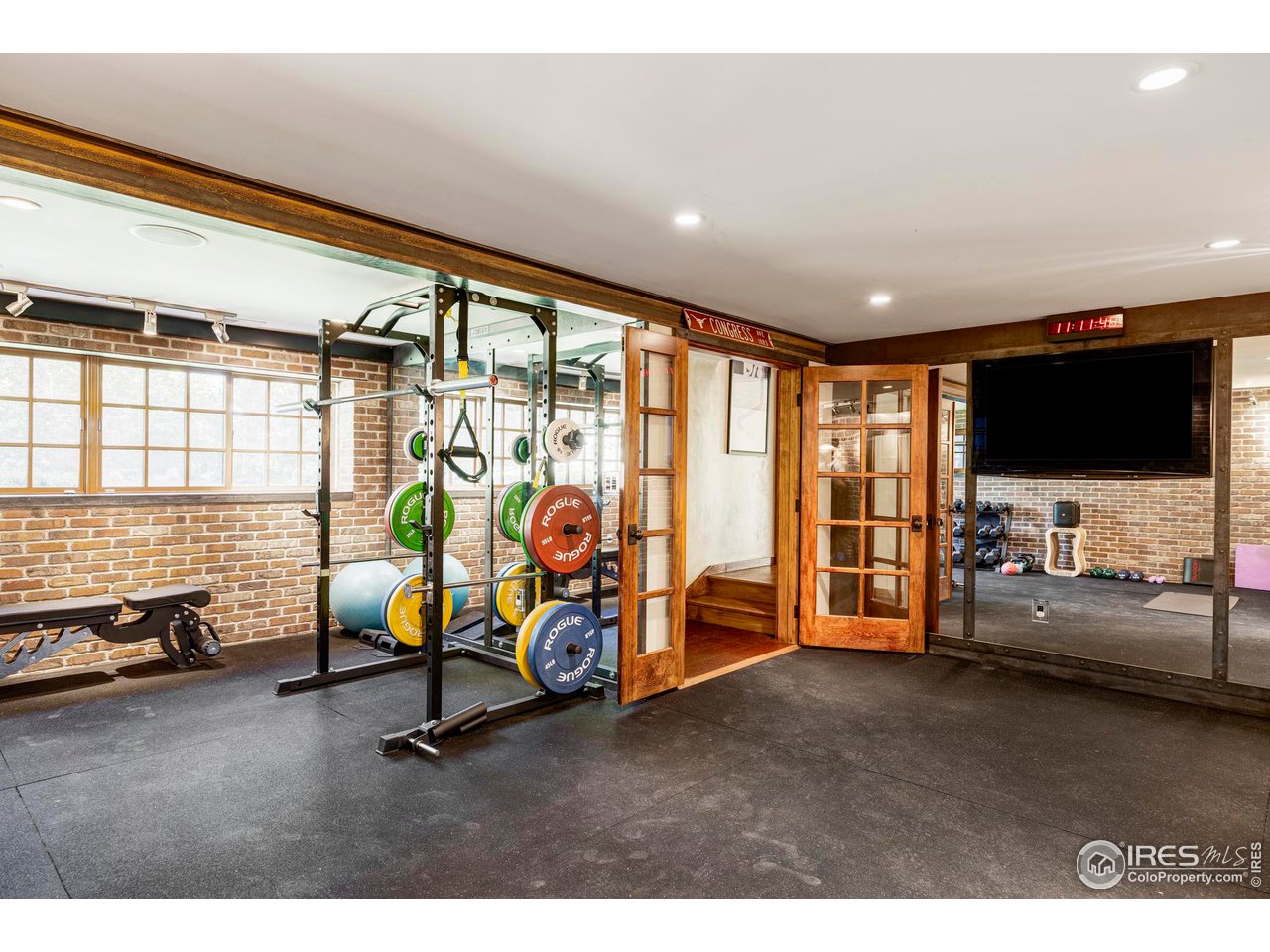 1213 17th Street Boulder, CO 80302 - Photo 24 of 38 a view of a livingroom with furniture and a flat screen tv