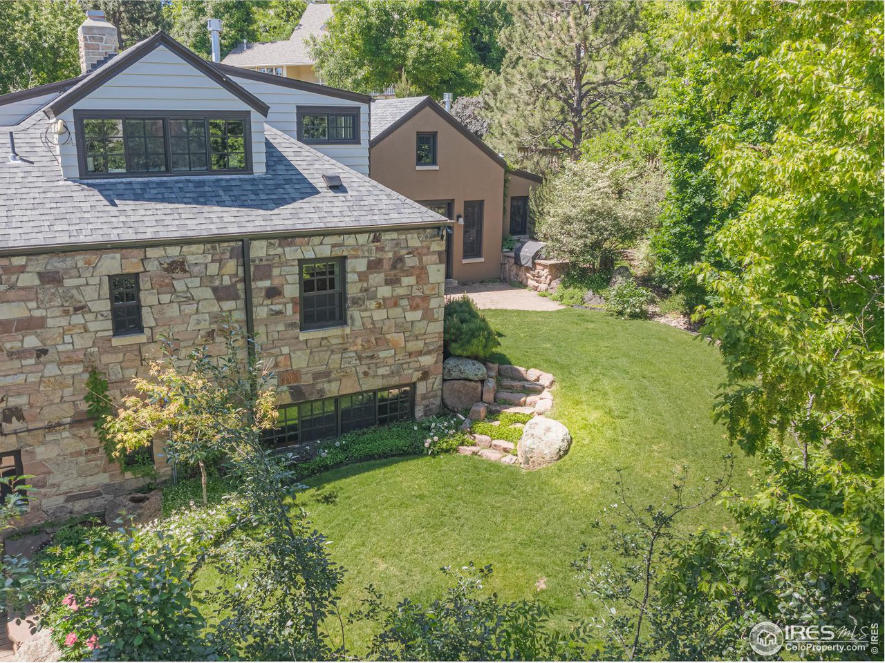 1213 17th Street Boulder, CO 80302 - Photo 28 of 38 a front view of a house with a yard