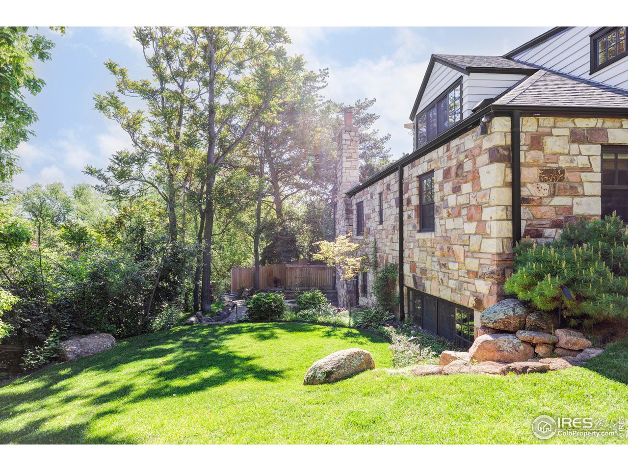 1213 17th Street Boulder, CO 80302 - Photo 30 of 38 a view of a house with backyard and sitting area