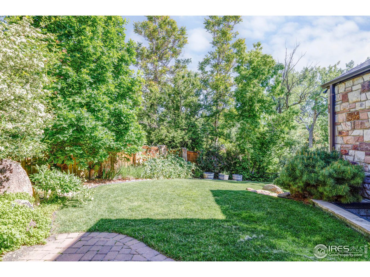 1213 17th Street Boulder, CO 80302 - Photo 31 of 38 a view of green field with trees in the background