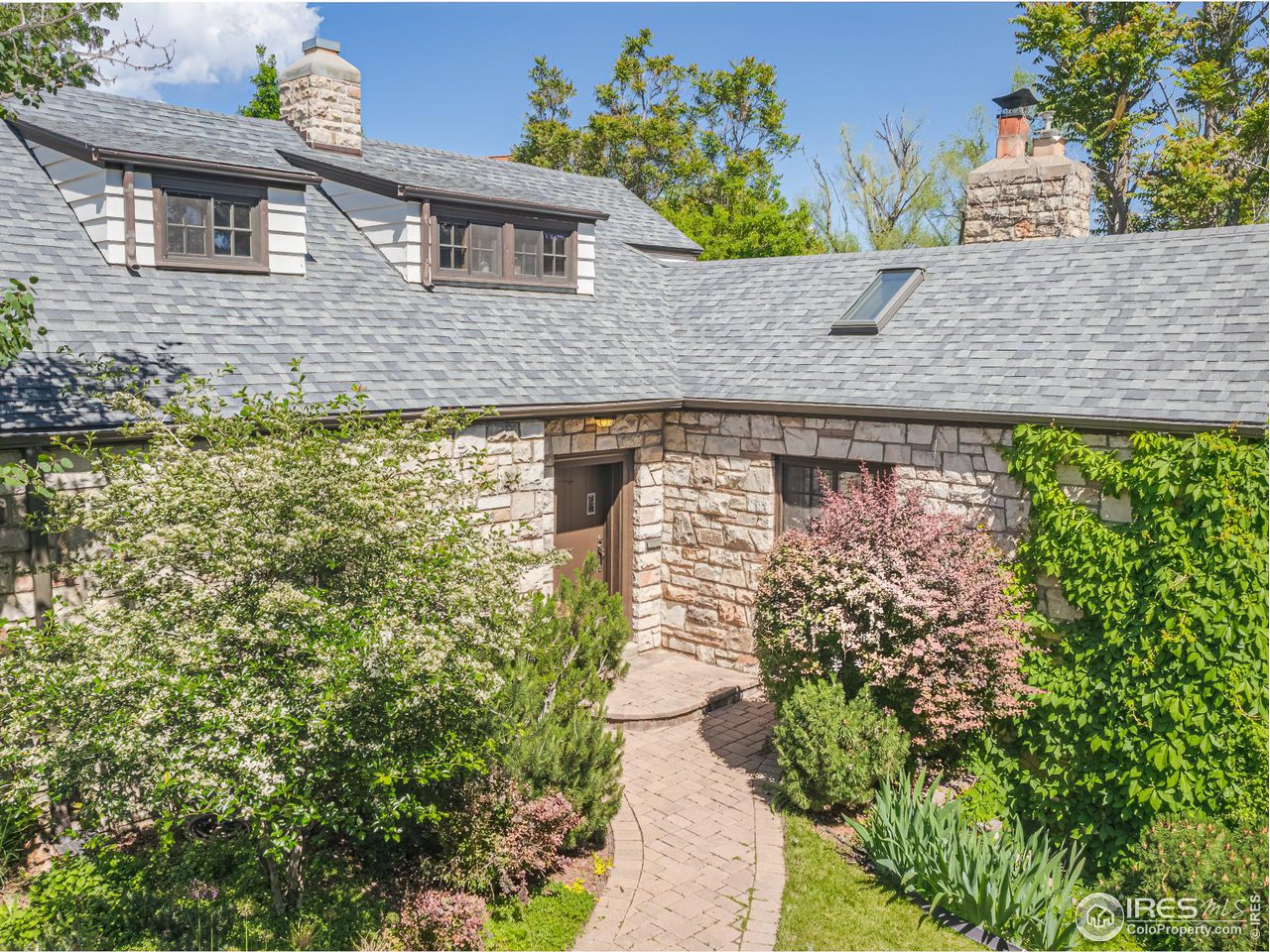 1213 17th Street Boulder, CO 80302 - Photo 34 of 38 a front view of a house with a yard
