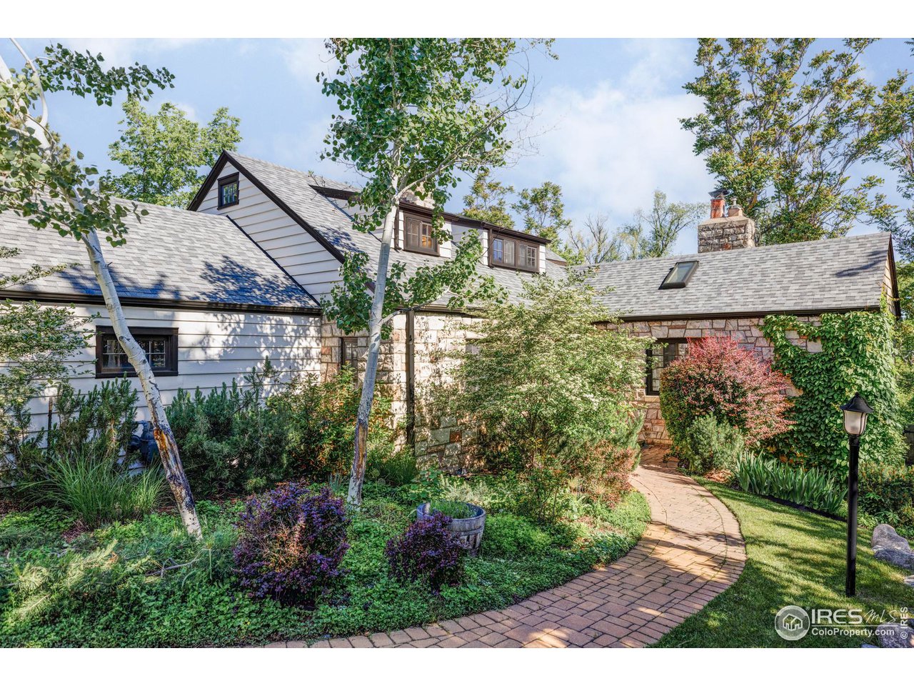 1213 17th Street Boulder, CO 80302 - Photo 36 of 38 a view of a house with a yard and plants
