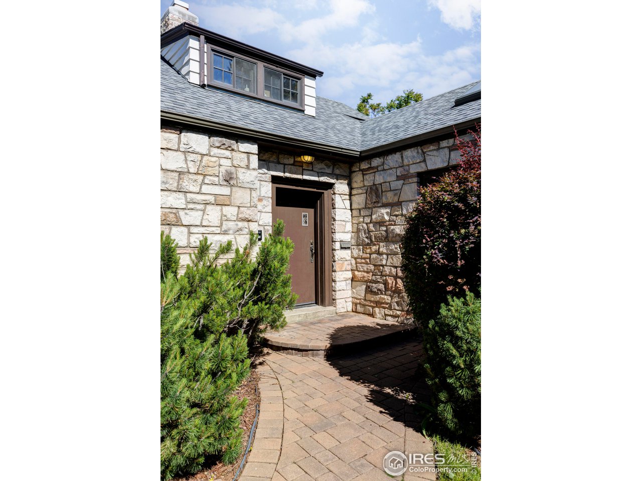 1213 17th Street Boulder, CO 80302 - Photo 37 of 38 a front view of a house with a yard