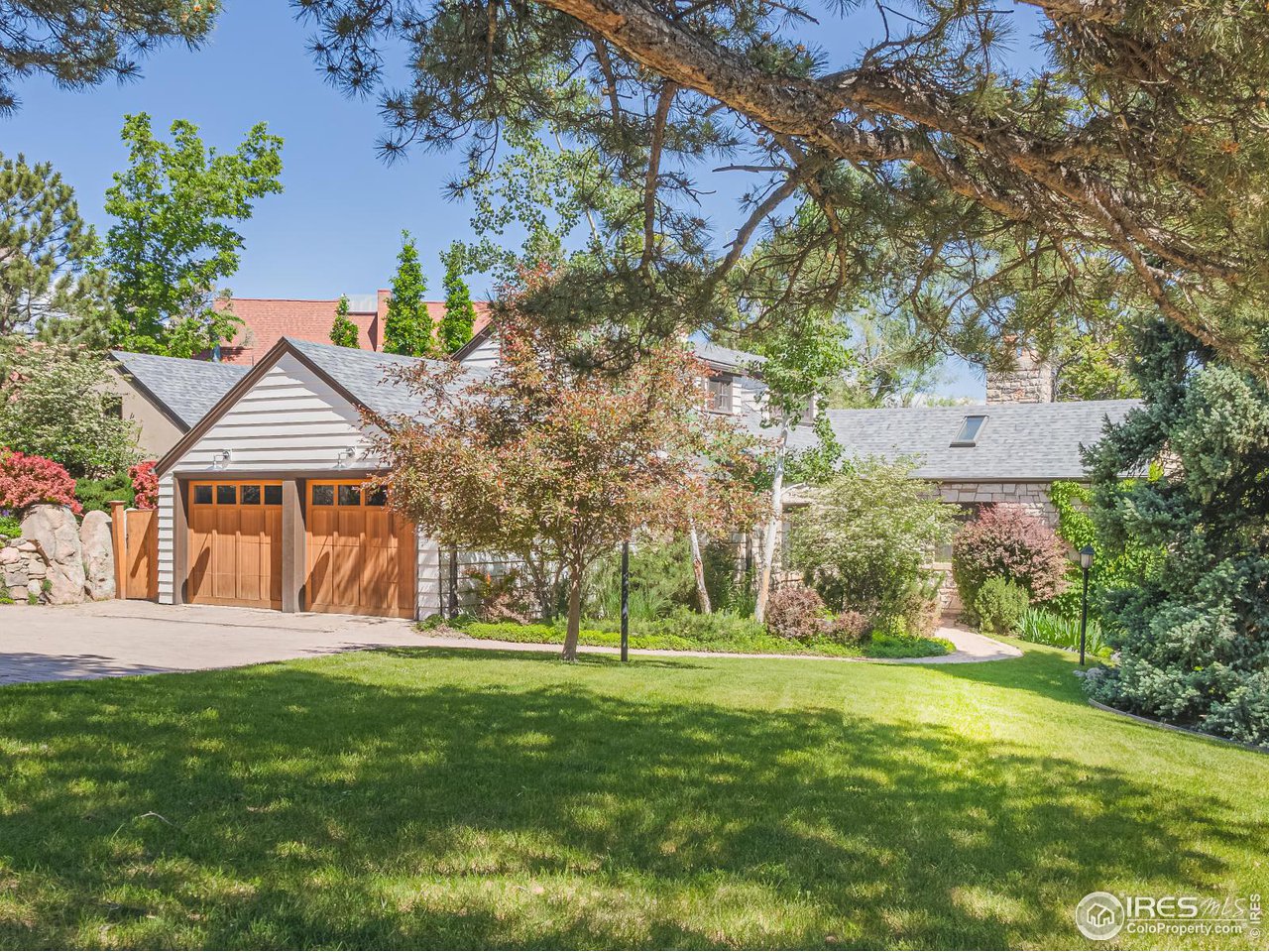 1213 17th Street Boulder, CO 80302 - Photo 38 of 38 a front view of a house with a yard