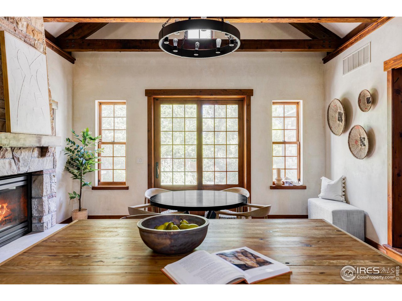 1213 17th Street Boulder, CO 80302 - Photo 6 of 38 a living room with fireplace and window