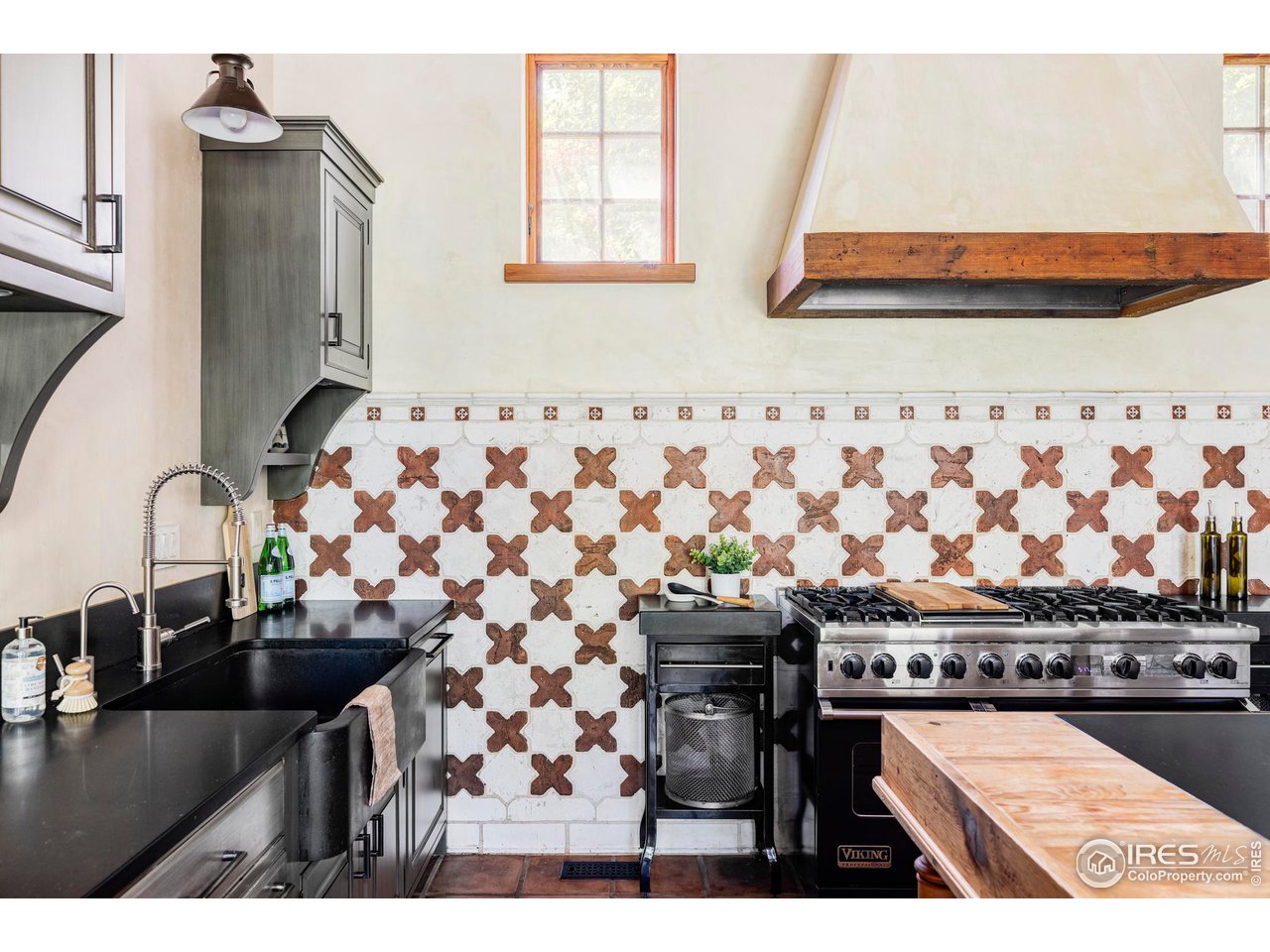 1213 17th Street Boulder, CO 80302 - Photo 10 of 38 a kitchen with a sink and a stove top oven