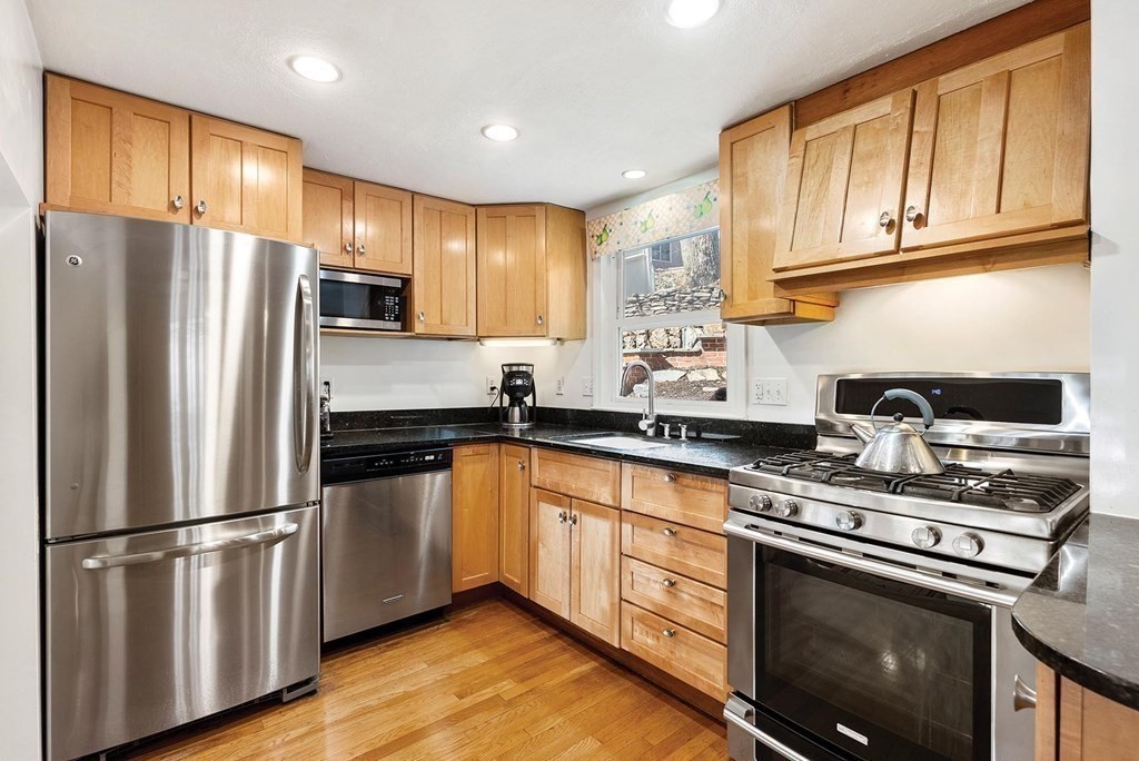 16 Conant Road Brookline, MA 02467 - Photo 12 of 31 a kitchen with stainless steel appliances granite countertop a refrigerator stove top oven and sink