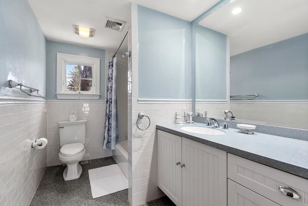 16 Conant Road Brookline, MA 02467 - Photo 20 of 31 a bathroom with a toilet sink and mirror