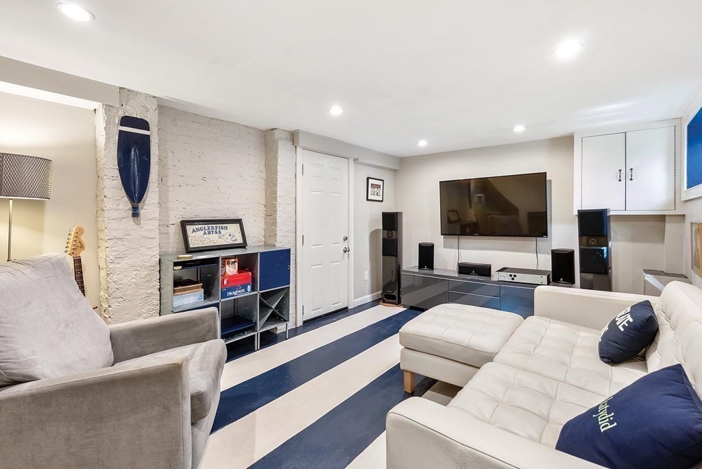 16 Conant Road Brookline, MA 02467 - Photo 28 of 31 a living room with furniture and a flat screen tv