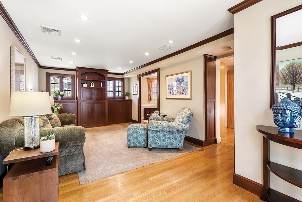 16 Conant Road Brookline, MA 02467 - Photo 7 of 31 a living room with furniture and a wooden floor