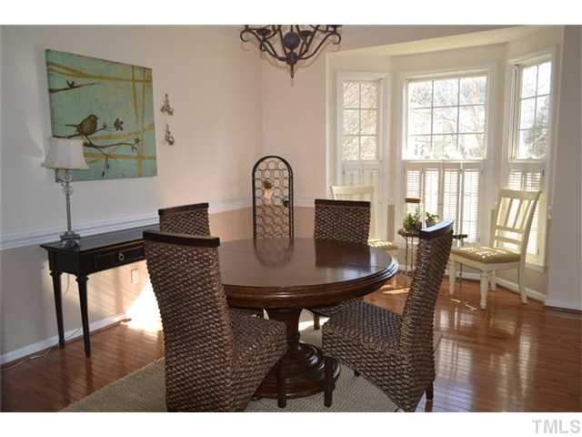 6937 Lamarsh Court Raleigh, NC 27617 - Photo 6 of 25 a view of a dining room with furniture window and wooden floor
