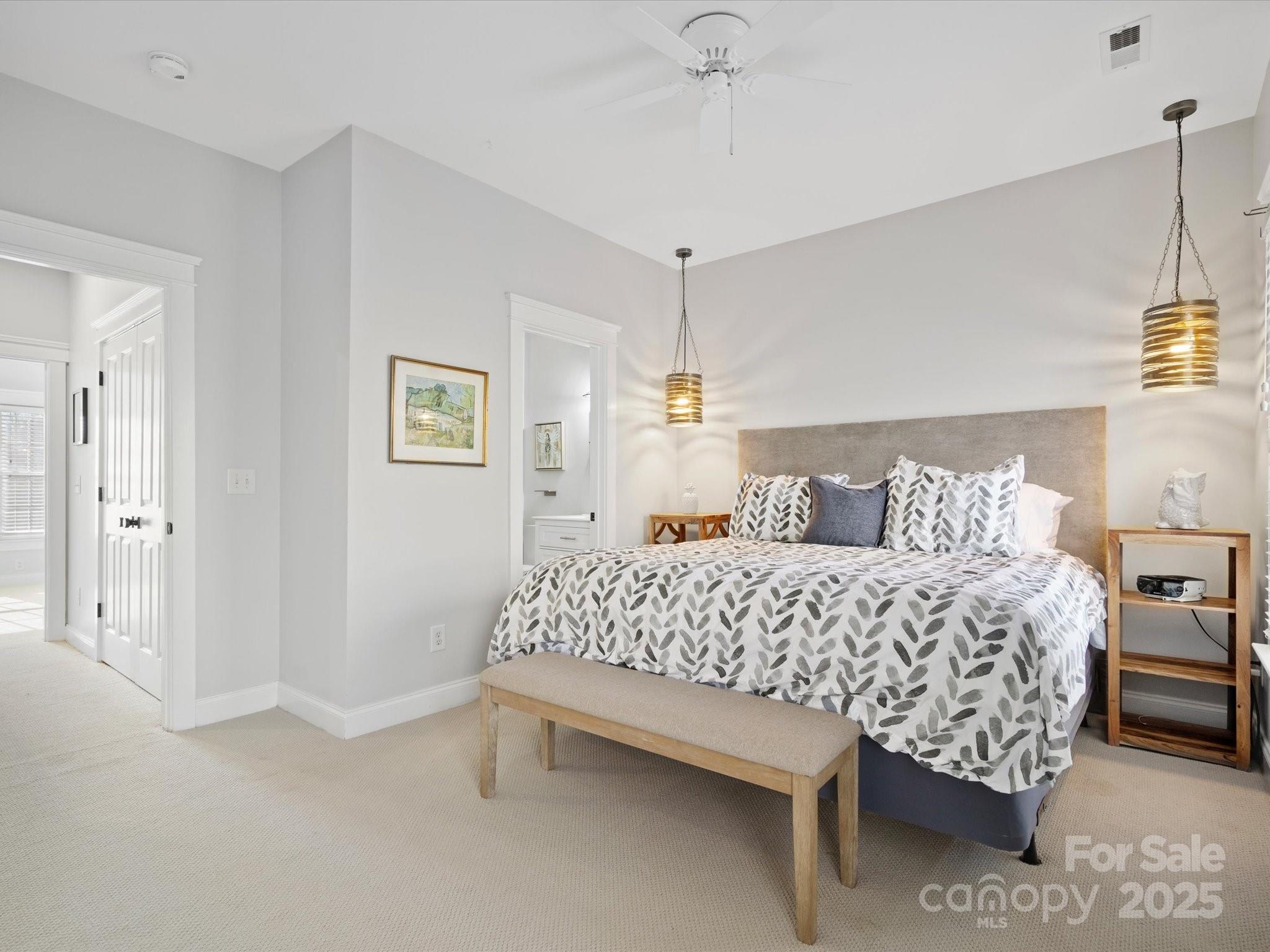 296 Elis Way Fort Mill, SC 29708 - Photo 15 of 31 a bed room with a bed and a chandelier