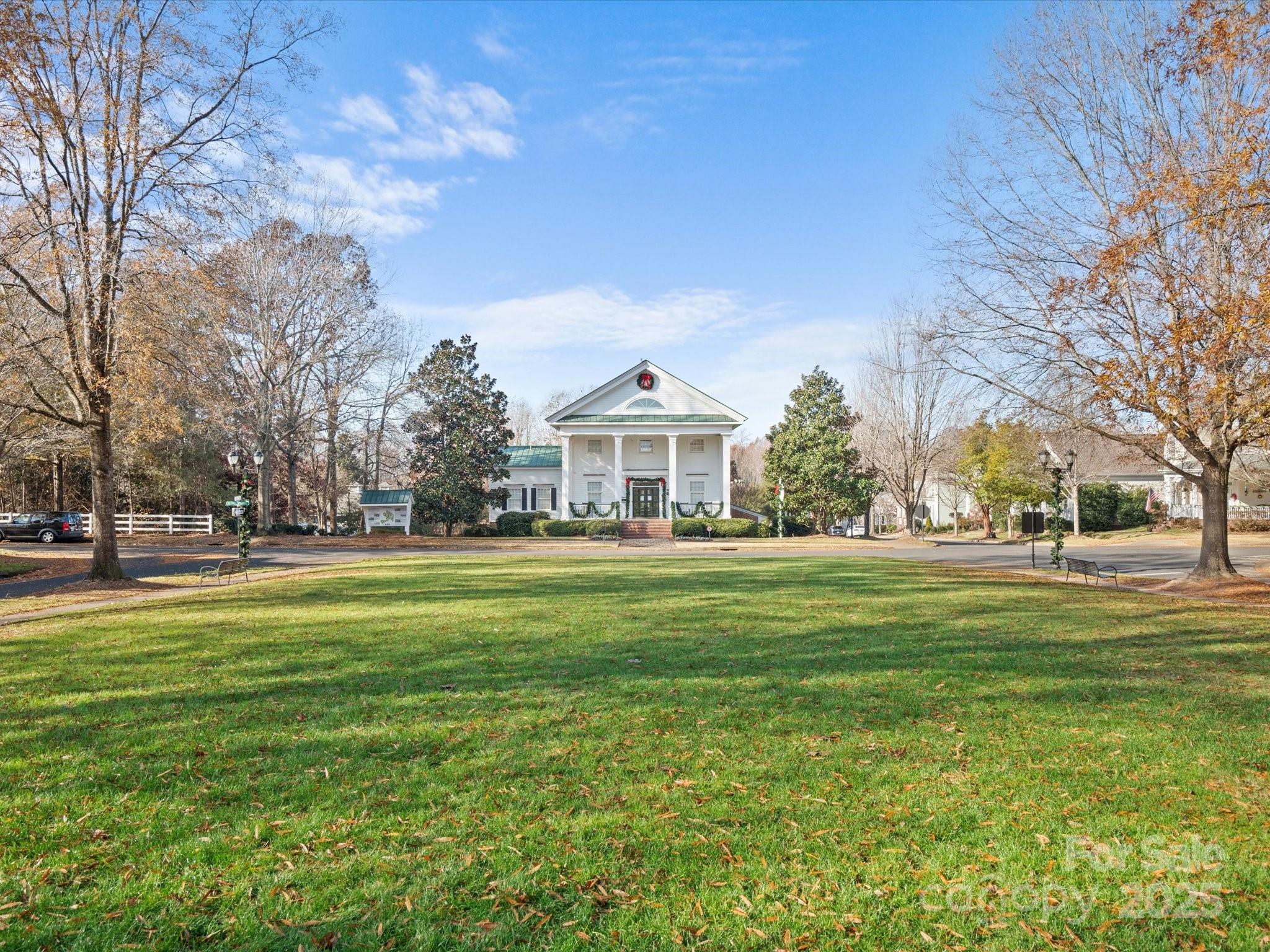 296 Elis Way Fort Mill, SC 29708 - Photo 23 of 31 a front view of a house with a garden and trees