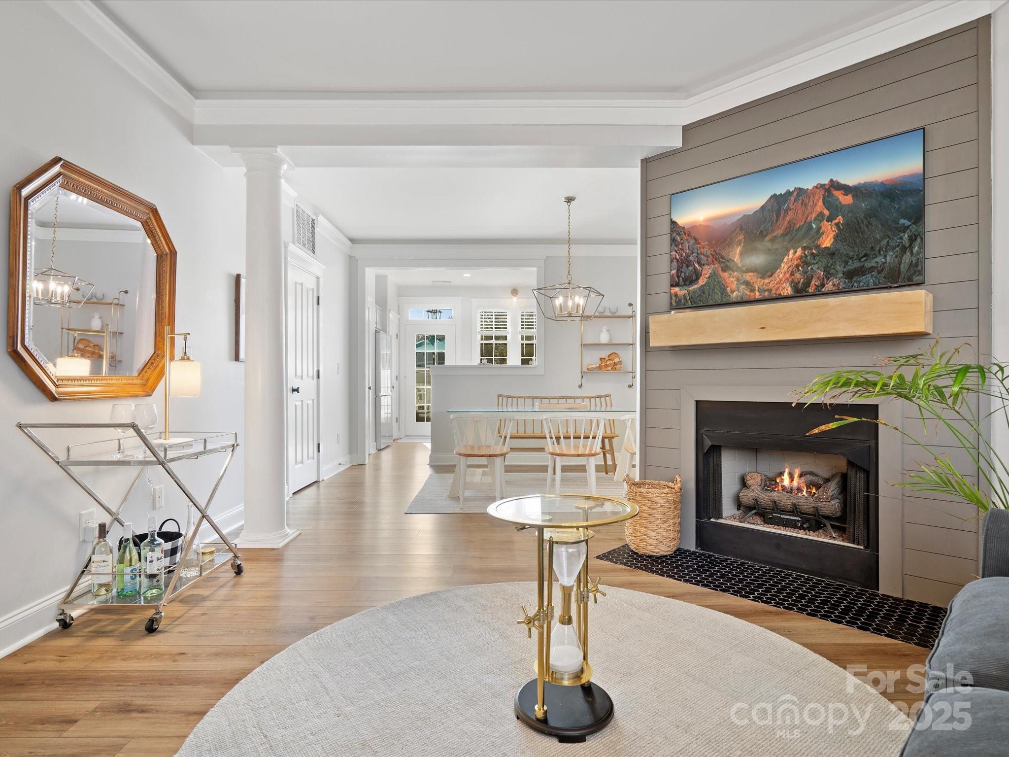 296 Elis Way Fort Mill, SC 29708 - Photo 6 of 31 a living room with furniture a fireplace and wall painting