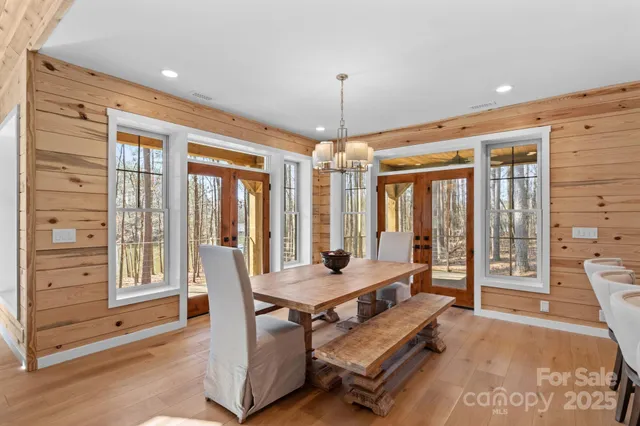 a living room with furniture and large windows