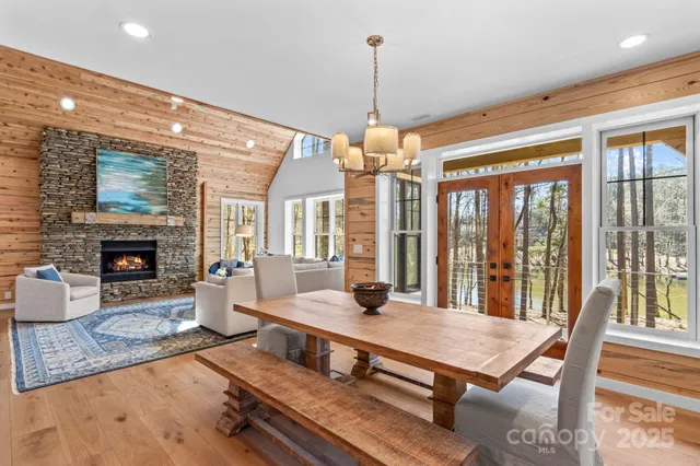 a living room with furniture a table and a fireplace
